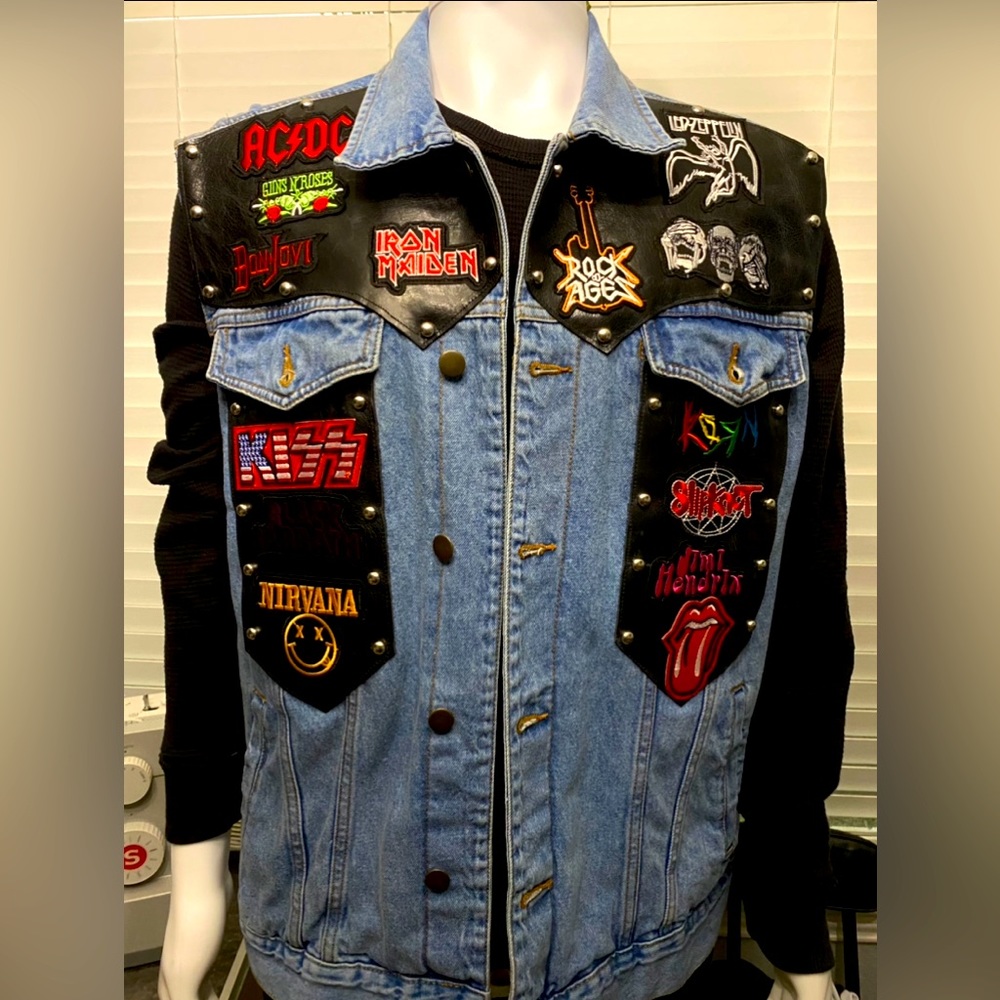 Studded denim battle vest. Backed by real leather